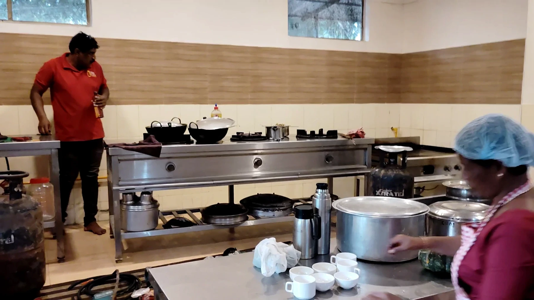 An image of a gascare professional installing an LPG pipe line in a workplace commercial kitchen