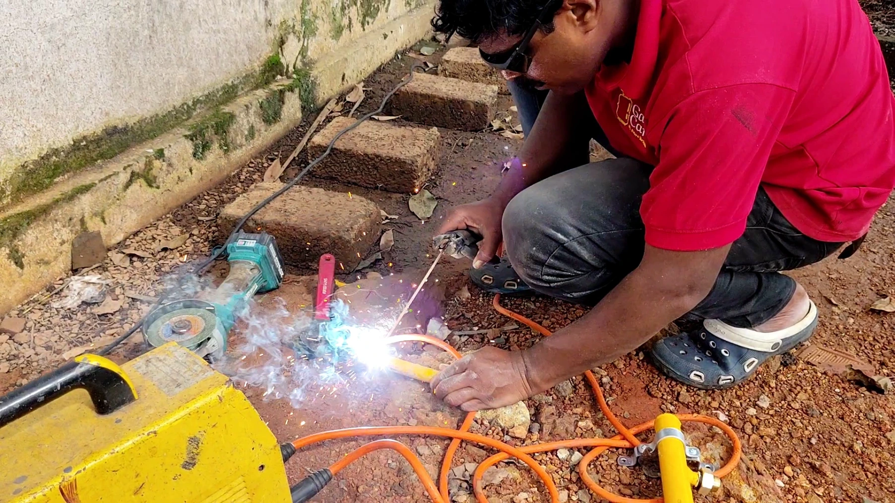 A Gas Care professional welds pipes for an LPG pipeline installation in a commercial kitchen