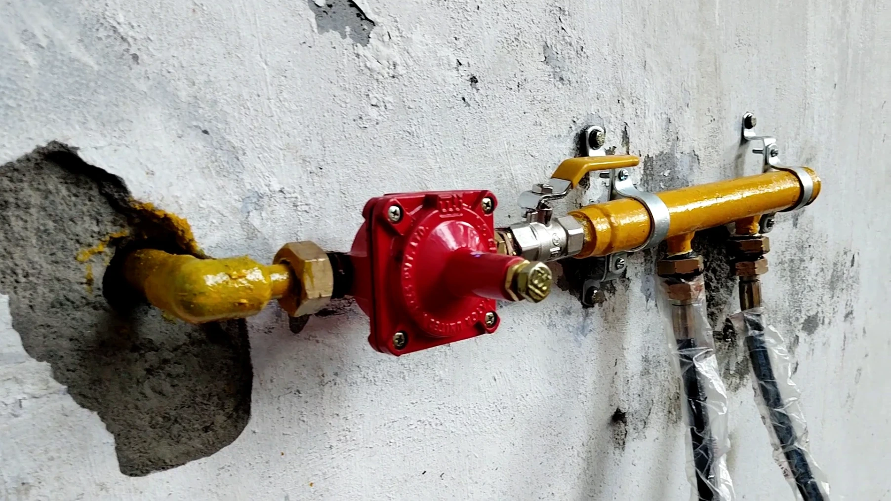 Our Gas Pipeline Installation Photo shows the connection to a gas stove from the main LPG pipe in a commercial kitchen
