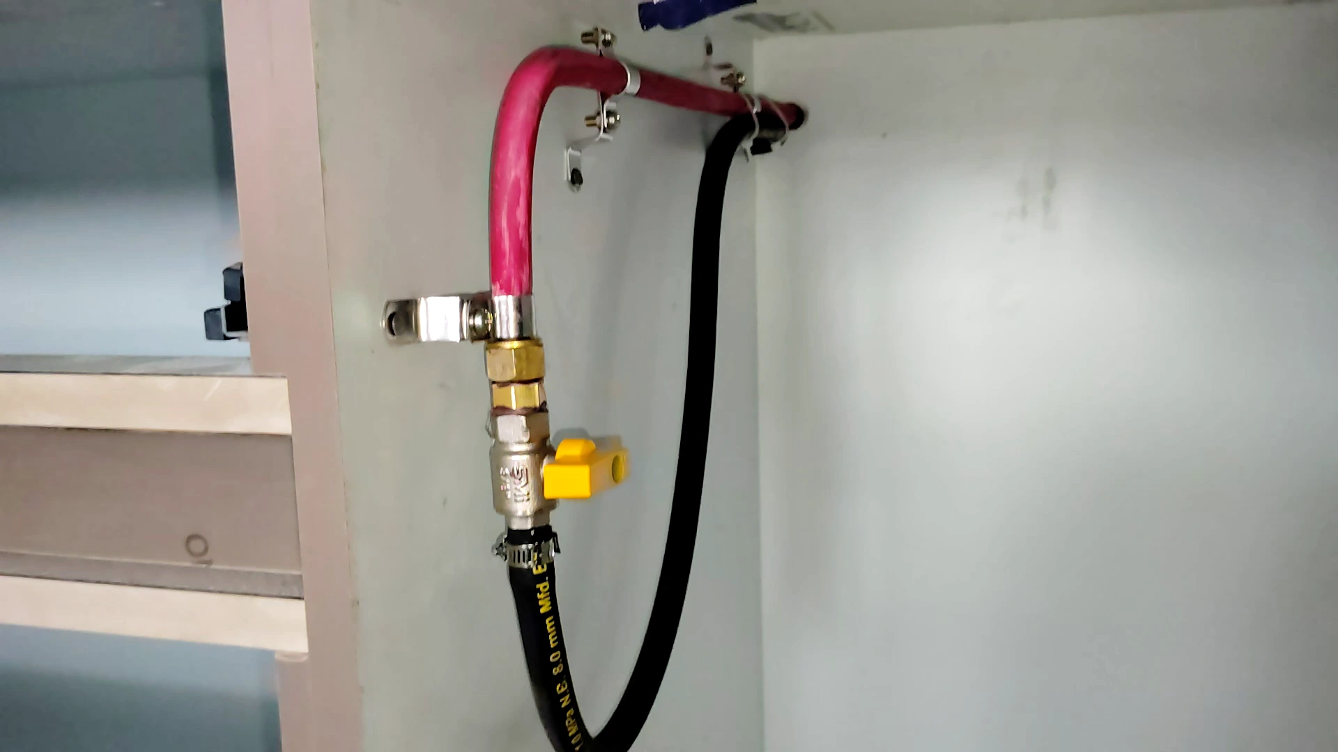 This is an image of gas care gas pipe line installation and connection to the cooktop in the kitchen