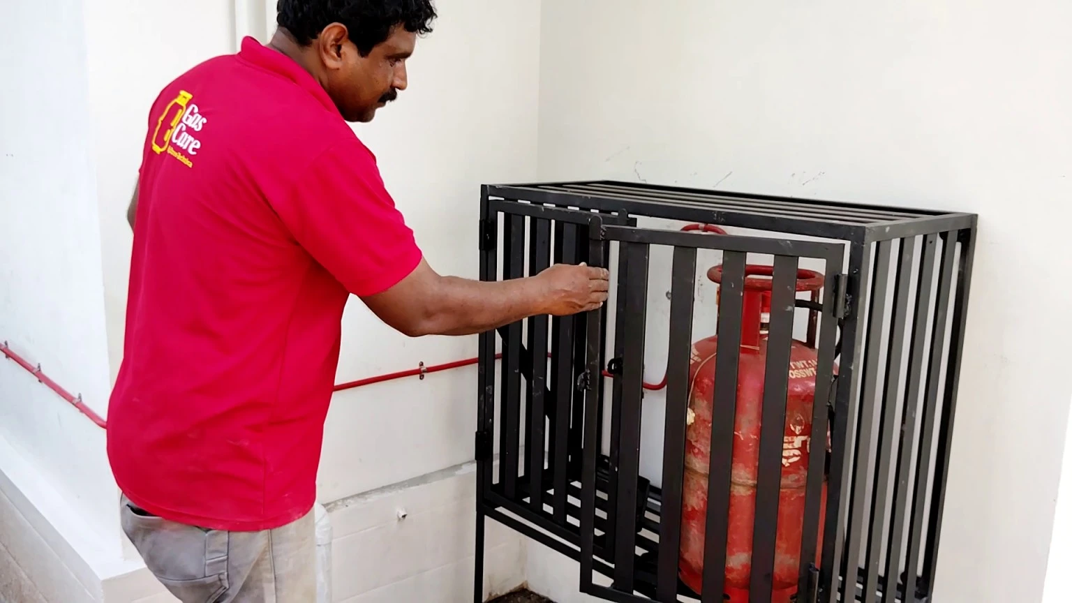 A snapshot shows a gas care professional evaluating a gas cage with cylinders after connecting a gas pipeline to the kitchen