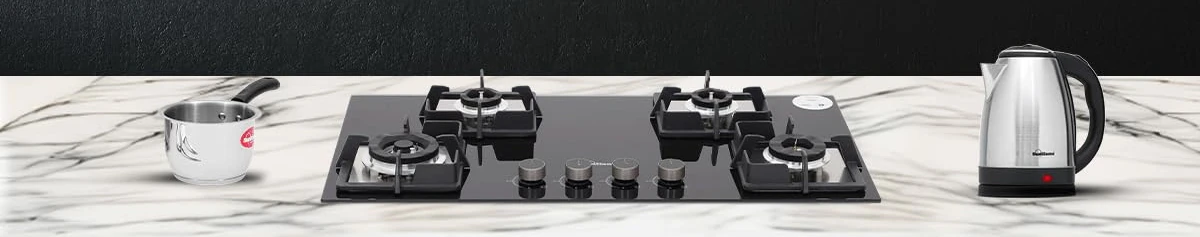 banner Image of a modern kitchen countertop with a gas stove, kettle, and sauce pan