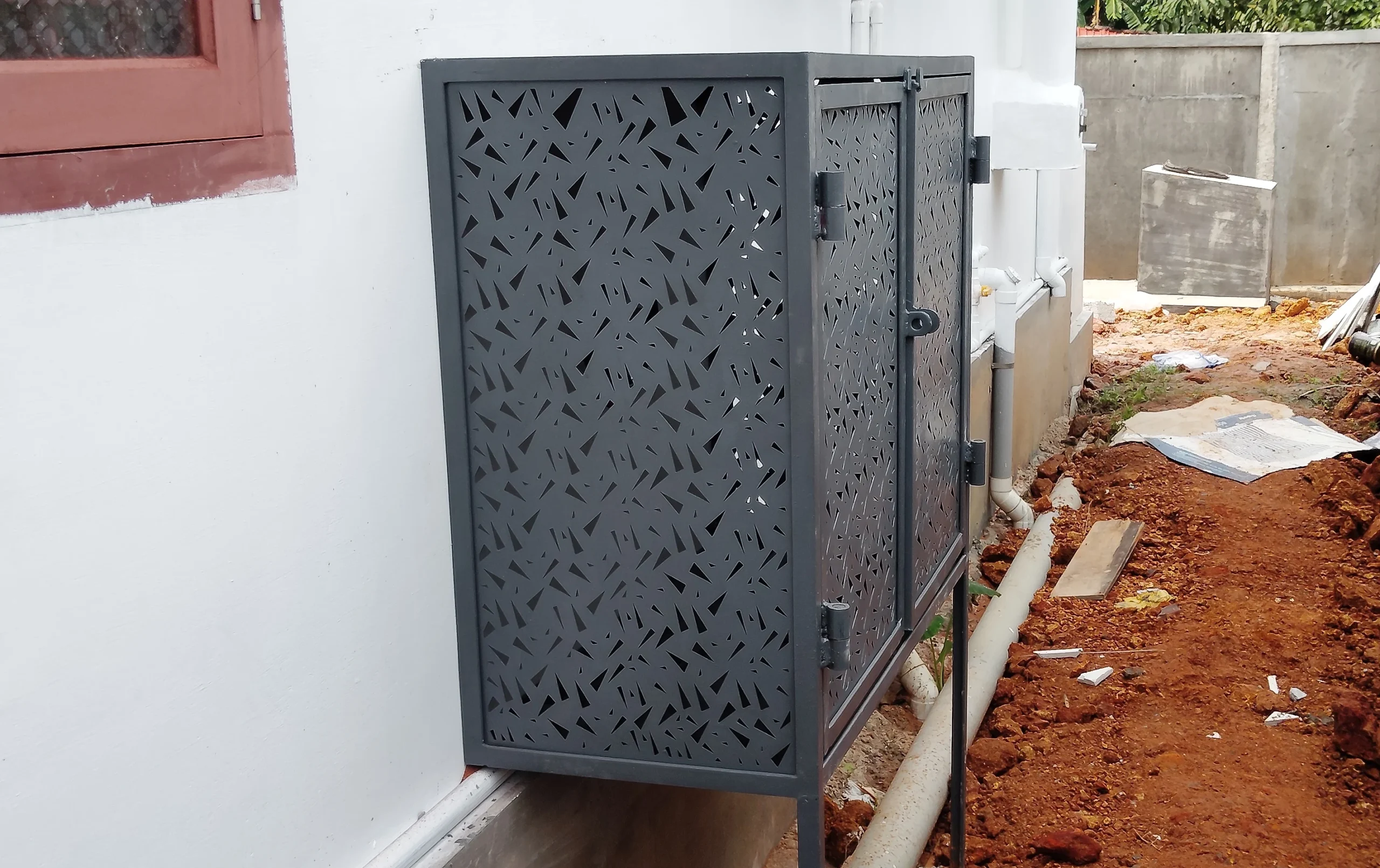 Our CNC cut gas cylinder storage cage is mounted on a residential building.