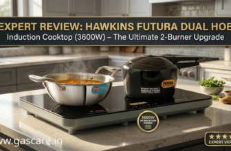 Featured banner for the expert review of the Hawkins Futura Dual Hob Induction Cooktop FIC2A1, displaying the 3600W two-burner black glass electric stove heating a stainless steel pan and a black Futura pressure cooker on a modern kitchen counter.