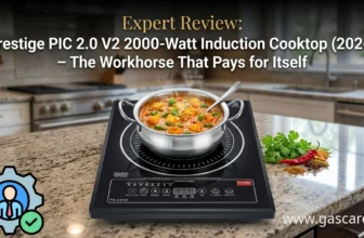 Featured banner image for the expert review of the Prestige PIC 2.0 V2 2000-Watt Induction Cooktop. The sleek, black radiant glass cooktop is displayed on a modern granite kitchen counter with a stainless steel pot of simmering Indian curry inside the anti-skid ring. The front feather-touch control panel featuring Indian preset menus is clearly visible. On the left, there is a spherical badge with a blue verified expert icon. Bold text overlay reads "Expert Review: Prestige PIC 2.0 V2 2000-Watt Induction Cooktop (2026) - The Workhorse That Pays for Itself". Brand: Prestige. www.gascare.in is written in the bottom-right corner.