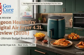 Featured banner image for a comprehensive Gas Care expert review of the Pigeon Healthifry Digital Air Fryer 4.2L (2026). The detailed image showcases the specific deep emerald green and copper air fryer on a polished dark concrete kitchen counter in an authentic, upscale modular kitchen in Thrissur, Kerala. Surrounding the air fryer are artistically arranged plates of appetizing air-fried foods: a copper bowl of golden french fries, a rustic plate with grilled salmon, charred tandoori cauliflower florets, and crispy chicken wings. The main headline, prominent in bold copper font, reads 'Pigeon Healthifry Digital Air Fryer 4.2L Review (2026)', with the subtitle 'The Ultimate Budget Breakdown'. Top-left features the Gas Care By Stove-Technica logo (cylinder icon and text), with the '2026 REVIEW' tag below it. The top-right shows 'The Pigeon Healthifry is our Top Budget Pick for 2026'. The bottom-left displays: 'Digital Air Fryer 4.2L | Best Under ₹3,000'. Through the window, a blurred Gas Care service vehicle with its logo is visible in the background. Soft, professional lighting highlights the textures and colors of the product and food. The entire image has a high-end, authoritative editorial finish for Gas Care By Stove-Technica and www.gascare.in.